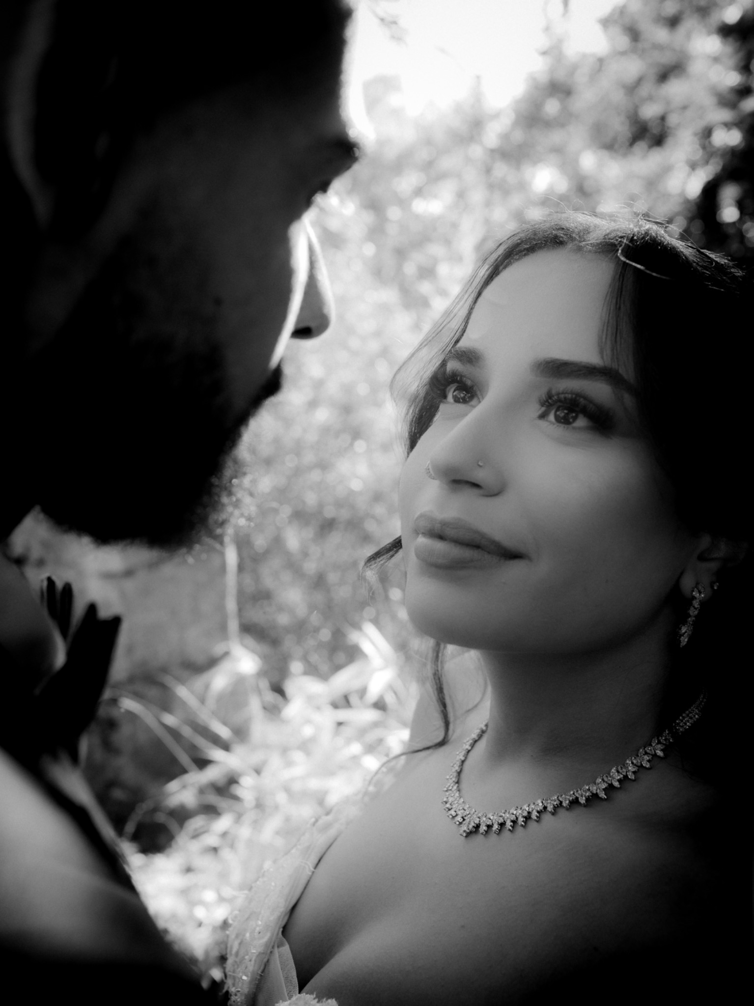 Newlyweds exchanging a glance in black and white